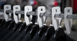 A rack with suits with rack dividers from Mark Bric Sizers